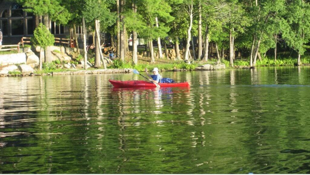 red kayak by the lakeshore