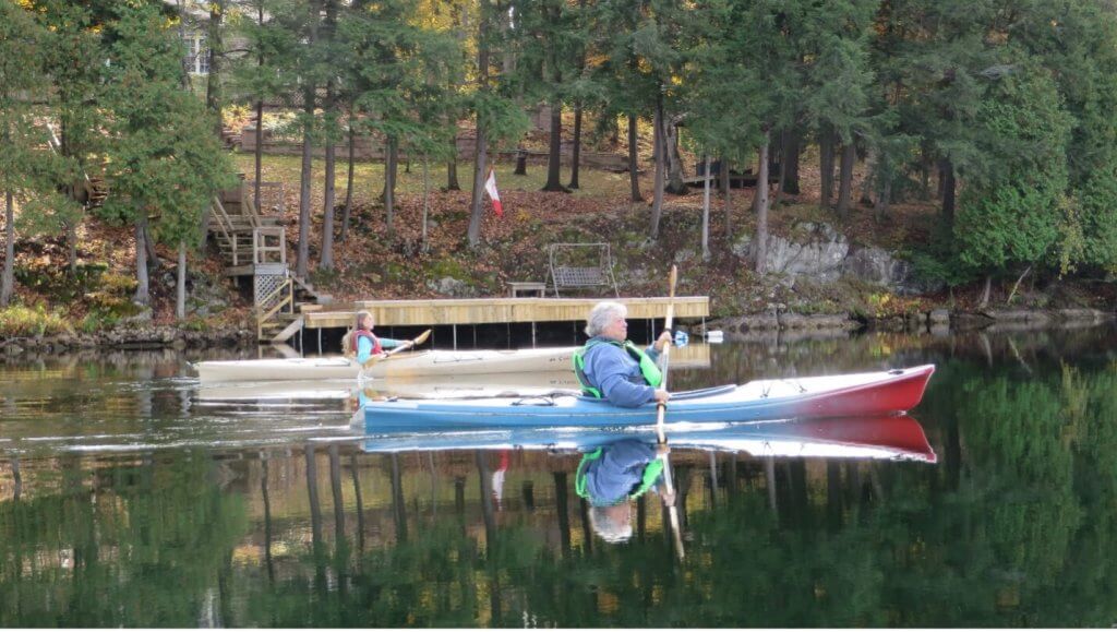 woman in multicolored kayak